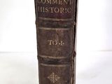 an old book that is sitting on a table