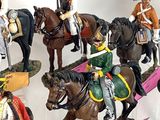 many figurines of soldiers on display in a display case