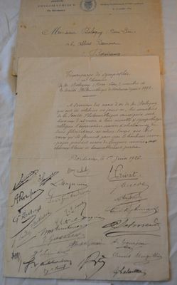 an old document with a lot of writing on it sitting on a table