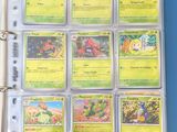 a close up of a binder with a bunch of pokemon cards on it