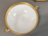 two cups and a saucer on a table
