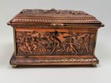 an antique bronze box with a scene of a man and a woman on horseback