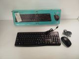 a keyboard and mouse sitting on a table next to a box