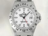 a close up of a watch on a white background with a red second hand