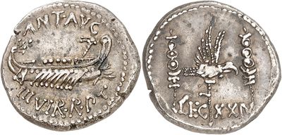 a silver coin with an image of a bird on it