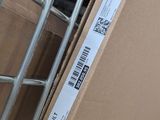 a box with a barcode on it sitting on the floor