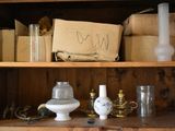 a wooden shelf with a lot of items on it