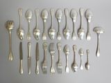 a lot of spoons and forks on the table