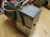 a small machine that is sitting on a wooden table