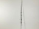 a fishing rod on a stand in a room with a white wall