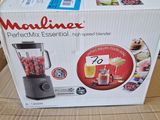 the box of a blender is sitting on a cardboard box
