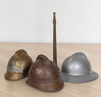 three helmets sitting next to each other on a table
