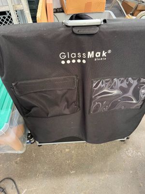 a suitcase that is sitting on a cart in the garage