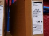 two boxes of acer products sit on a shelf in a store