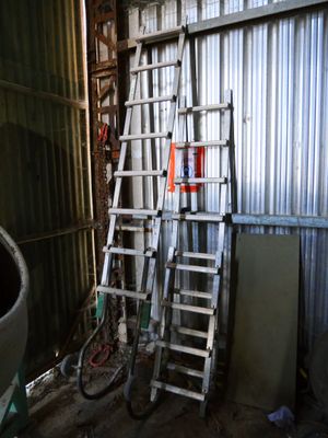 a ladder leaning up against a wall in a garage