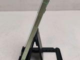 a cell phone that is sitting on top of a stand