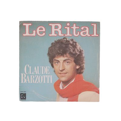 the cover of a magazine with a picture of a man in a red shirt