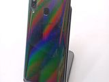 a phone that is sitting on a stand on a table