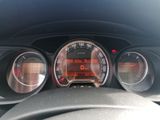 a close up of a car dashboard with a speedometer and gauges