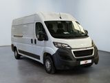 the white van is parked in the empty room of the building