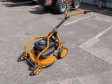 a small machine that is sitting in the parking lot