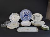 a lot of plates and bowls sitting on a table