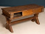 a wooden bench with a drawer on top of it