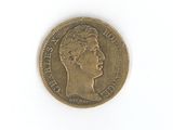 a gold coin with a woman ' s face on it