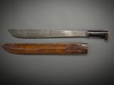 two knives are sitting side by side on a gray surface
