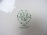 a close up of a plate with a logo on it