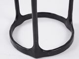 a close up of a black metal table with a glass top