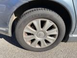 a close up of a car ' s tire on the road
