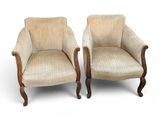 paire de fauteuils rembourrés avec accoudoirs et pieds tournés