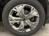 a close up view of a car ' s wheel and tire