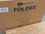 a cardboard box with a picture of a child ' s high chair in it