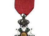 l'image d'une médaille surmontée d'une étoile