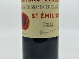 a bottle of wine that is sitting on a table