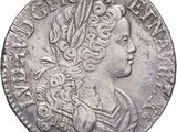 a close up of a coin with a woman ' s head on it
