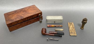a wooden box with various items in it on a table