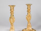 pair of antique brass candlesticks on marble bases