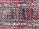 an old persian rug with a red and blue design on it
