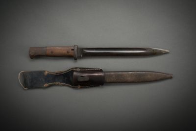 two knives that are sitting next to each other on a table