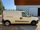 a white van that is parked in front of a building