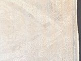 a close up of a piece of fabric with a white design on it