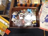 a brown box filled with assorted items on a table