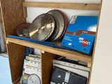 a wooden shelf with a saw blade on top of it