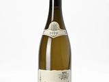 bottle of white wine on a white surface with a white background