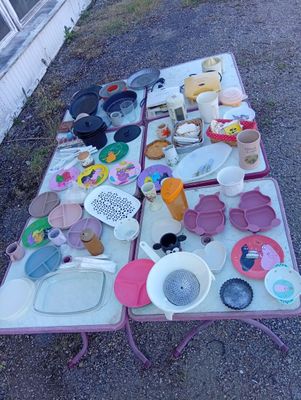 a table that has a lot of dishes and cups on it