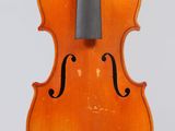 an orange violin with a black bow on a white background