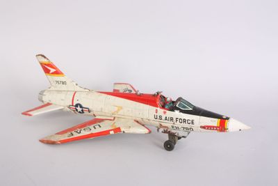 a toy airplane that is sitting on a white surface